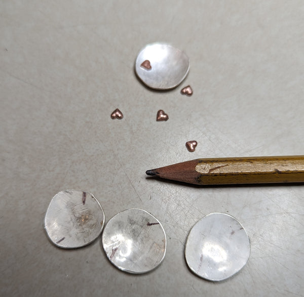 recycled silver discs with copper hearts